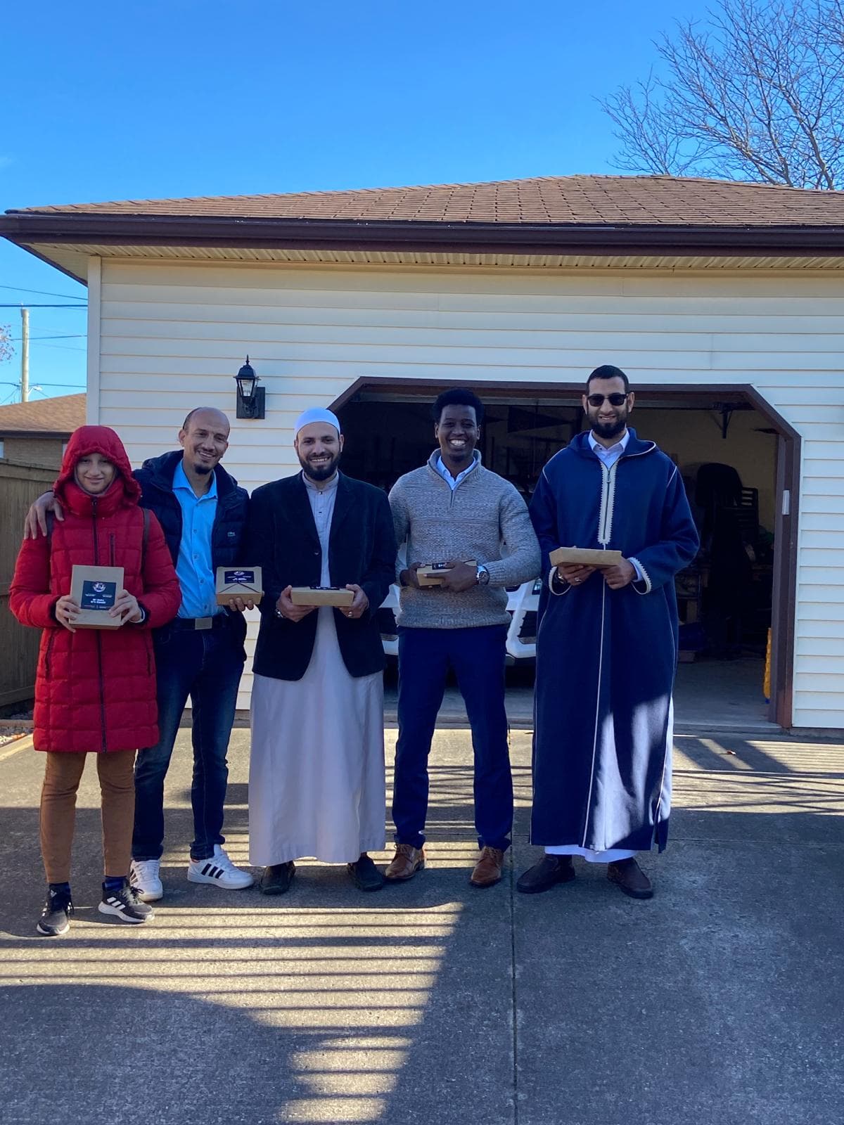 Volunteers with awards outside the masjid