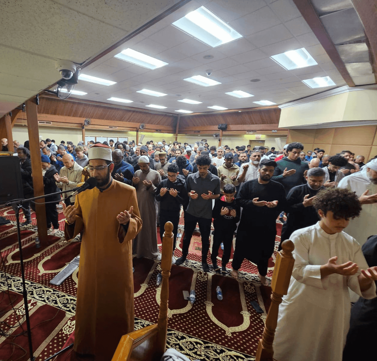 Imam leading prayer at the masjid